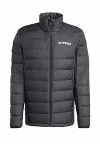 Black puffer jacket with a high collar, quilted design, front zipper, and TERREX logo on the left chest. Durable material, lightweight.