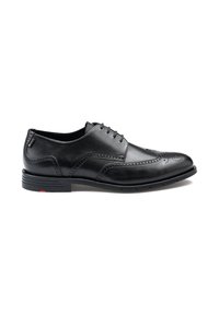 Chaussures habillées en cuir noir avec une texture lisse, design à ailes, détails brogue et semelle en caoutchouc avec une petite touche de rouge.