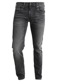 Slim-fit tmavě šedé džíny z denimu s pěti kapsami, předním zapínáním na knoflík a minimalistickými detaily prošití. Měkká, odolná látka.