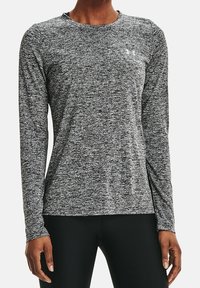 Langärmliges Sportshirt in einem schwarz-weißen Melange-Muster. Weicher, atmungsaktiver Stoff mit Rundhalsausschnitt und Logodetail auf der Brust.
