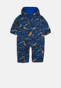 Sateenitikkauspuvut sinisen, ruskean ja tummansinisen kamoflaatilla. Varustettu hupulla, lyhyillä hihoilla ja etuvetoketjulla, valmistettu sileästä, eristetystä kankaasta.