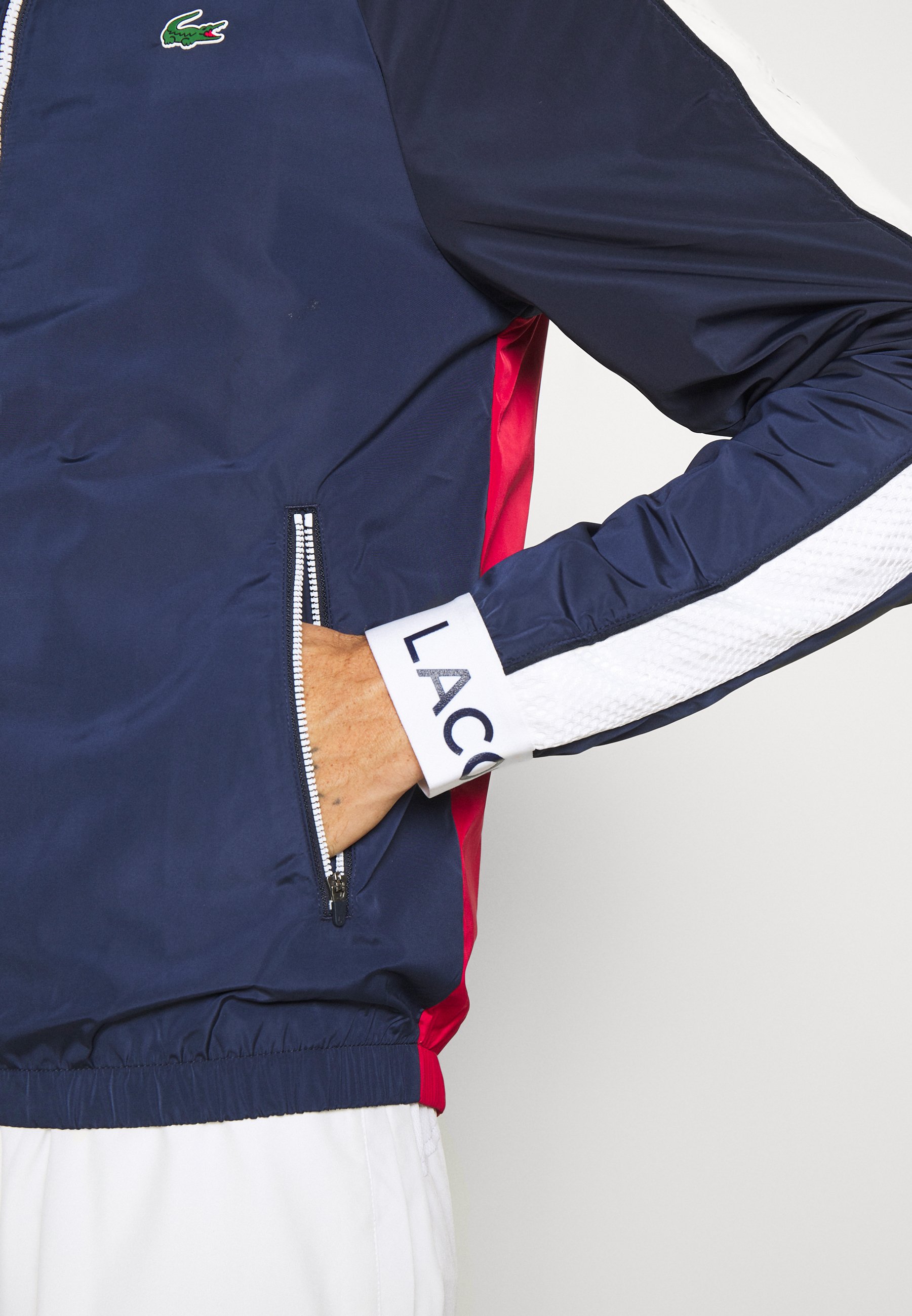 white and navy jacket