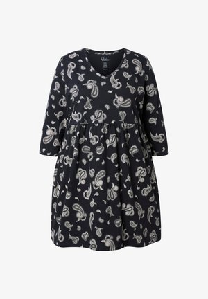 Sort V-halskjole med hvidt paisleymønster, lange ærmer og samlet talje detalje.