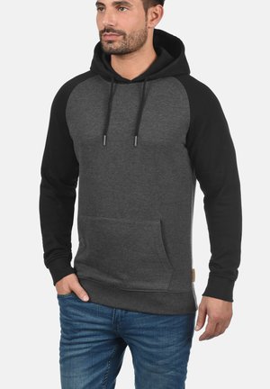 Hooded sweatshirt in dark gray and black, featuring a kangaroo pocket, long sleeves, and a drawstring. Soft fabric with contrasting accents.