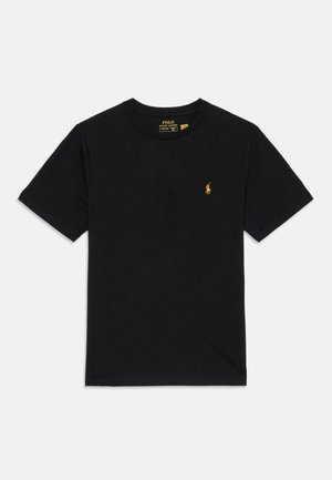 T-shirt noir à manches courtes et col rond avec un petit logo de joueur de polo Ralph Lauren jaune sur la poitrine gauche.