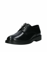 Scarpa in pelle nera con lacci, dalla finitura liscia, punta rotonda e suola in gomma spessa. Cuciture minime e senza hardware o dettagli visibili.