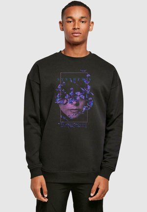 Black sweatshirt with a crew neck; features a graphic print of a face surrounded by colorful flowers, text "SYNTHESIS EVANESCENCE".