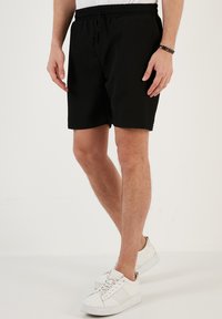 SLIM FIT - Shorts - black