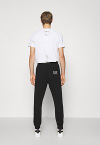 EA7 Emporio Armani TROUSER - Tréningruha alsók - black