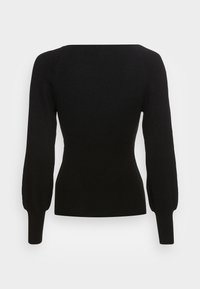 Pull noir en maille côtelée avec manches longues bouffantes et poignets ajustés, vu de dos sur un fond clair uni.