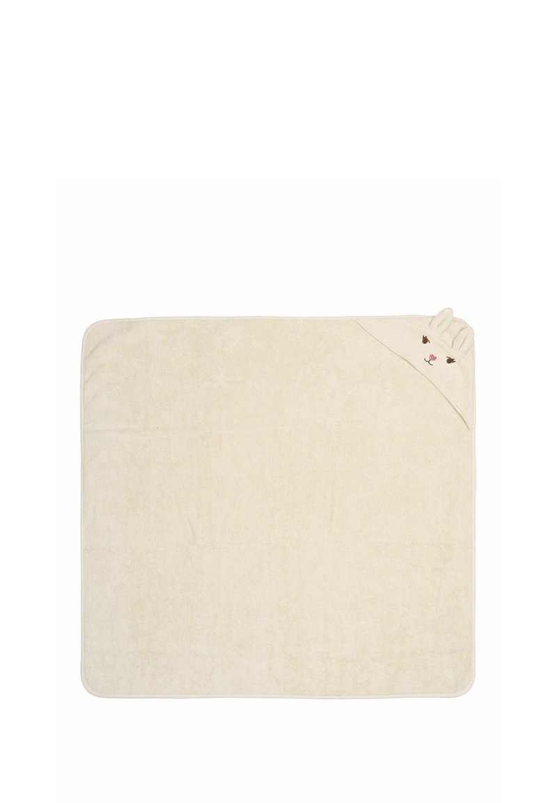 Håndklæde med et blødt, beige stof og et legesygt design, der inkluderer et bjørneansigt og ører i et hjørne, tilføjer tekstur og detaljer.
