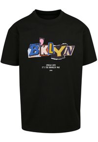 Black cotton t-shirt featuring a colorful collage text design with "BKLYN," and the slogan "Spread Love It's The Brooklyn Way, 1994."