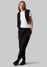 Calvin Klein Jeans MONOLOGO CUFFED PANT - Treningo apatinė dalis - black