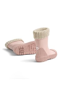Rosa wasserdichte Gummistiefel mit geripptem Design, gestricktem beigen Bündchen und profilierter Sohle für besseren Halt. Seitlich mit Logo versehen.