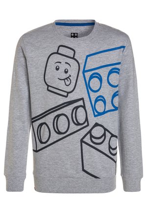 Szara bluza z dużymi czarnymi i niebieskimi klockami Lego w stylu kreskówkowym oraz nadrukowaną z przodu twarzą w stylu Lego z wystawionym językiem.