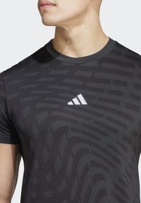adidas Performance GYM SEAMLESS - Sportovní tričko - black   grey six
