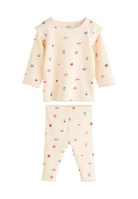 Vaaleankeltainen ribattuja pyjamapuku, jossa pitkät hihat ja legginsit, koristeltu värikkäillä hedelmillä, kukilla ja sateenkaarikuoseilla. Rypytettyjä yksityiskohtia.