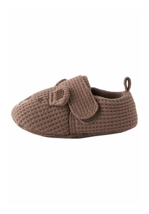 Brown textured baby shoe with a hook-and-loop strap and a small fabric loop at the heel for easy pull-on.