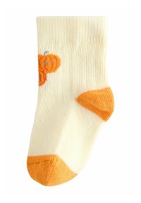 Light yellow cotton sock with orange heel and toe accents, featuring a textured ribbed design and an orange floral pattern on the side.