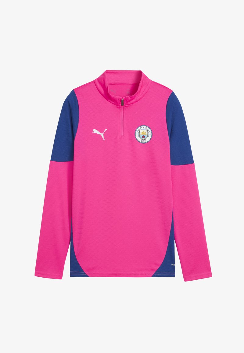 Haut de sport à manches longues rose avec accents bleu marine, col montant, demi-fermeture éclair et logo de Manchester City sur la poitrine. Fabriqué en tissu respirant.