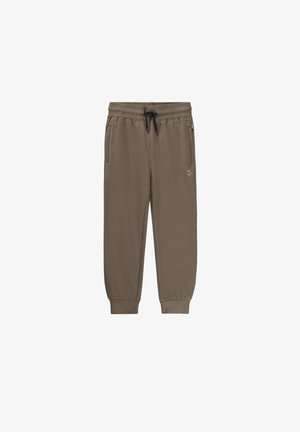 Pantalon de jogging marron à taille élastique avec cordon noir, poches latérales, chevilles côtelées et petit logo smiley blanc sur la cuisse gauche.