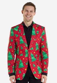 Rode blazer met een patroon van groene kerstbomen en gele sterren. Voorzien van notch revers, twee knopen en zijzakken. Soepele stoftextuur.