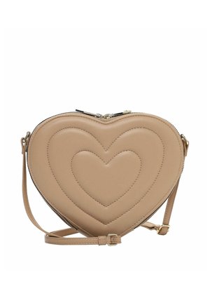 Beige heart-shaped crossbody bag with stitched heart patterns and an adjustable strap, closed by a zipper on top.