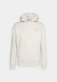 Felpa beige con cappuccio regolabile, tasca a marsupio, polsini e orlo a costine. Piccolo logo sul lato sinistro del petto in rosso, bianco e blu.