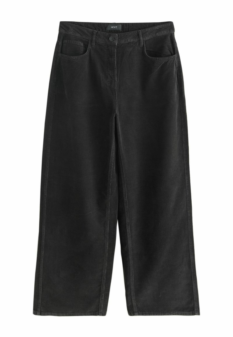 Musträpits mustad laiad püksid kõrge vöökohtadega, kahe eesoleva tasku ja nööbi sulgemisega. Tekstureeritud kangas vertikaalsete soontega detailidega.