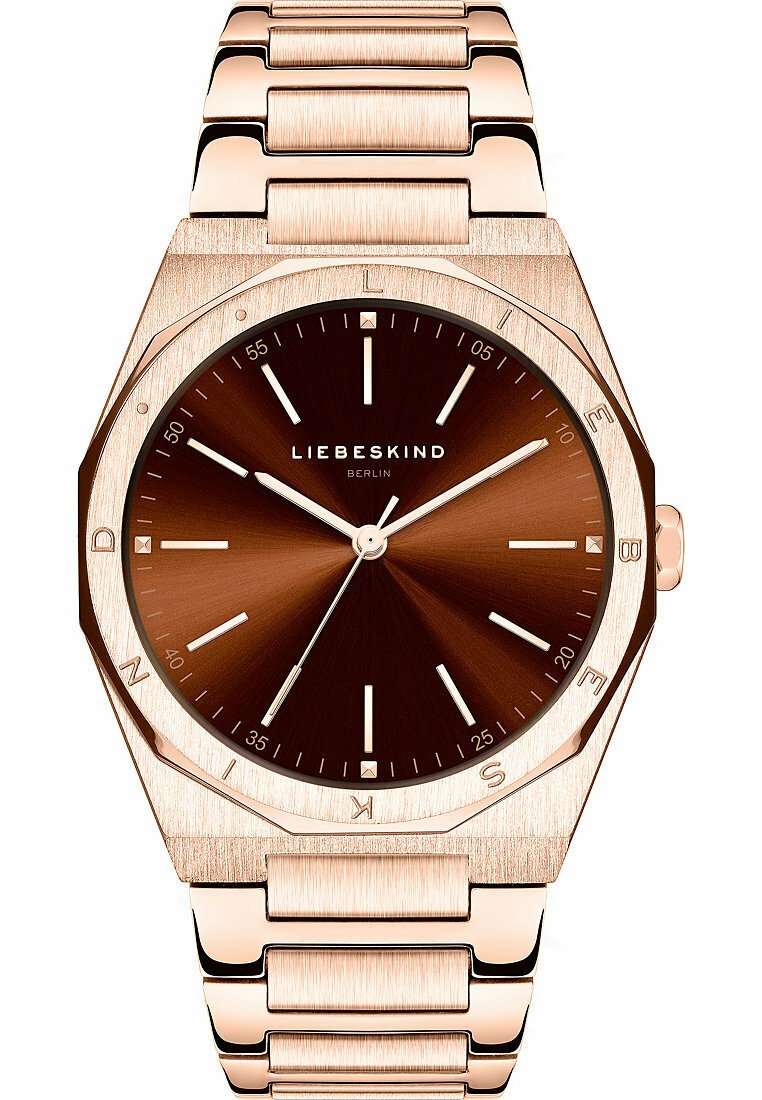 Montre octogonale en or rose avec un cadran marron et des index en argent. Dotée d'un bracelet en maillons métalliques et d'un design minimaliste.