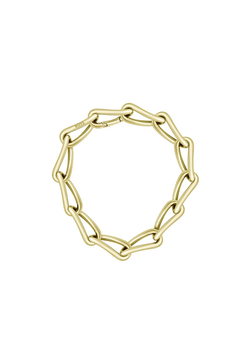 Pulsera de cadena en tono dorado con eslabones ovalados entrelazados, textura suave y un cierre seguro. Diseño minimalista con una estética moderna.
