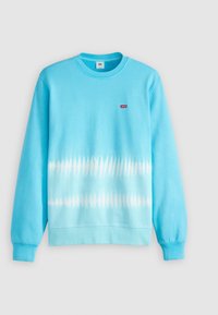 Sudadera azul claro de mezcla de algodón, con un patrón tie-dye degradado con acentos blancos, cuello redondo y puños acanalados. Pequeño logo en el pecho.