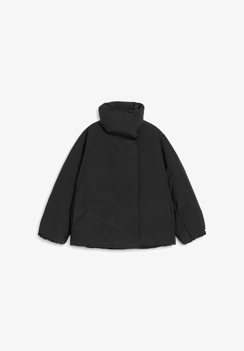Black puffer jacket with a high collar, oversized shape, and minimalistic design. Made from a smooth, non-reflective fabric.