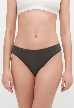 Donkergroene katoenen bikini-onderbroek met een gladde textuur, medium tailleband en een lage snit. Minimalistisch ontwerp zonder zichtbare patronen of accenten.