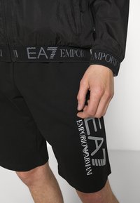 EA7 Emporio Armani Tunn jacka - black