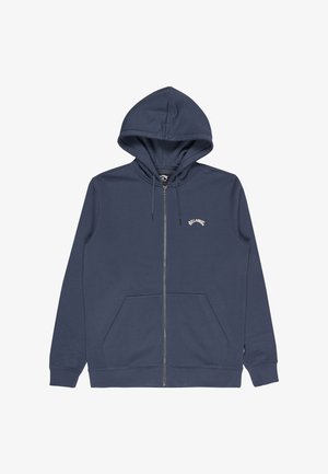 Sudadera con cremallera en azul marino, con cordones, bolsillo frontal tipo canguro y pequeño logo blanco de "Billabong" en el lado izquierdo del pecho.