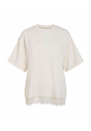 Haut crème à manches courtes avec encolure ronde et bordure en dentelle à l'ourlet, coupe ample et style décontracté.