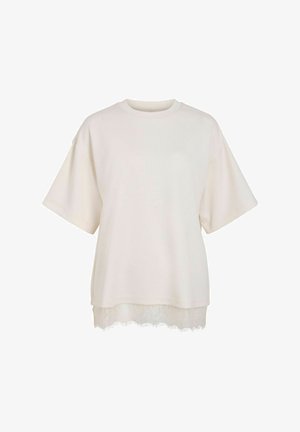 Haut crème à manches courtes avec encolure ronde et bordure en dentelle à l'ourlet, coupe ample et style décontracté.