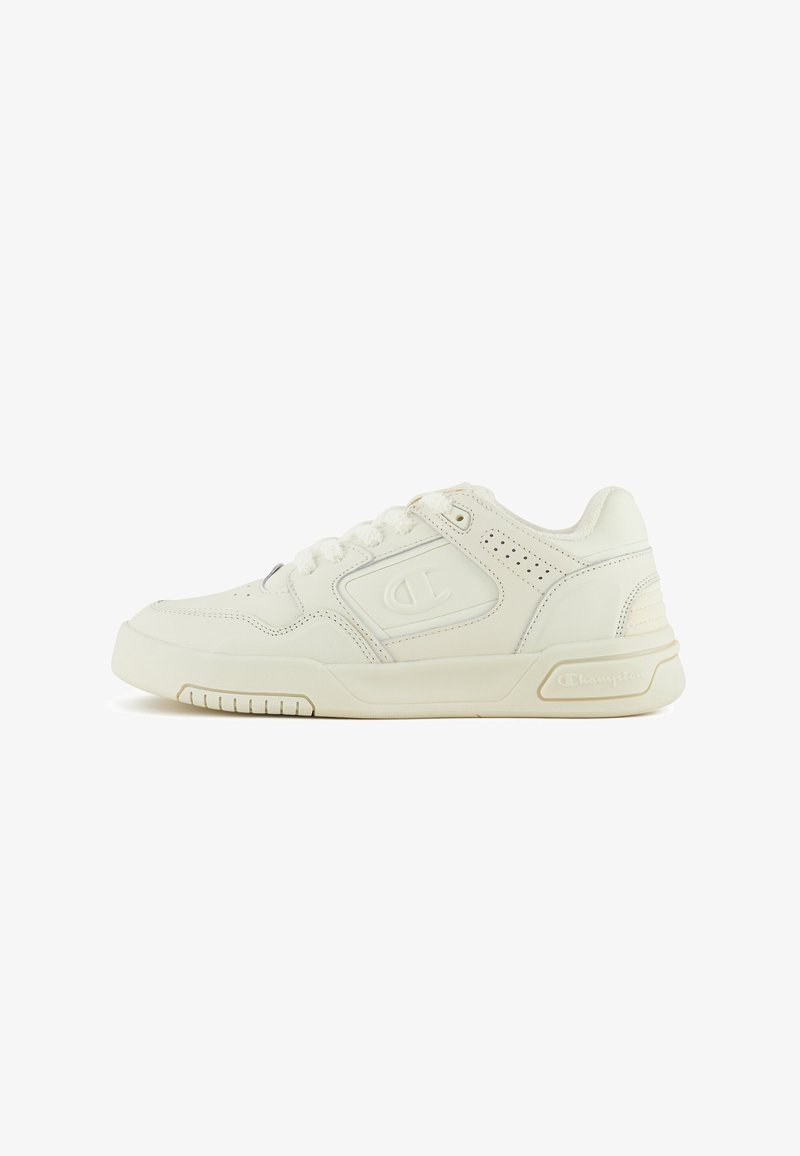 White leather sneaker with perforated detailing, textured rubber sole, and a Champion logo on the side. Features flat laces and a padded collar.