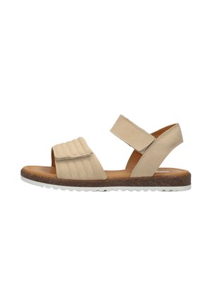 Beige sandalen met open teen, twee verstelbare klittenbandsluitingen en een gestructureerde witte zool, zijaanzicht tegen een witte achtergrond.