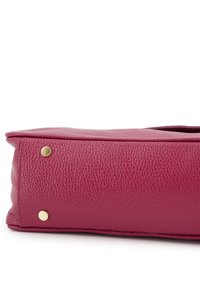 Fuchsia leather handbag with a textured surface, rectangular shape, and gold hardware accents on the base for stability.