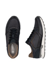 Black athletic shoes with a mix of smooth leather and mesh. Features gray accents, round toe, flat rubber sole, and lace-up front.