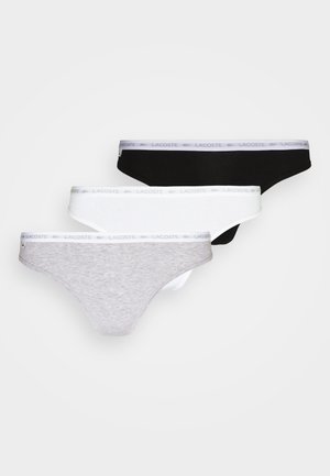 Tre par thong undertøy i grå, hvit og svart. Laget av myk stoff, med en elastisk midjebånd prydet med logo.