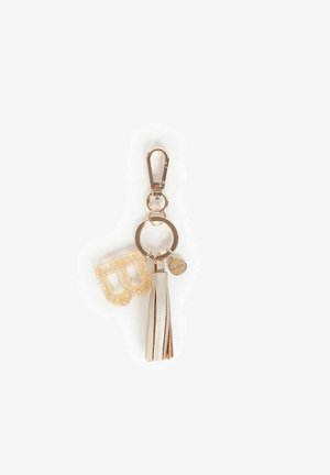 Portachiavi con lettera "B" in glitter oro, una frangia in ecopelle beige e un gancio e anello in tonalità argento per il fissaggio.