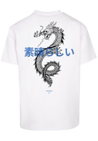 White t-shirt featuring a large black dragon graphic, accented with blue Japanese text. The design is centered on the back side.