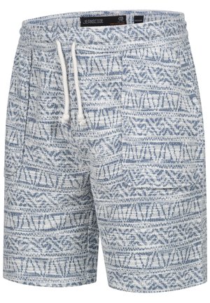 Blauwe shorts met een patroon, gemaakt van gestructureerde stof. Voorzien van een trekkoord in de taille en geometrische ontwerpen in verschillende tinten blauw op een witte achtergrond.