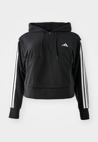 Zwarte cropped hoodie van zachte stof. Hij heeft een frontzak, een capuchon met trekkoord en witte drie-strepen accenten op de mouwen.