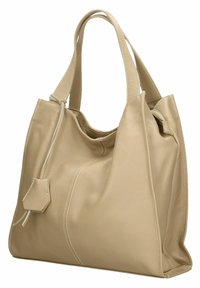 Beige leren tote bag met een slungelige uitstraling, zichtbare naden en een zijrits zak. Voorzien van twee stevige handvatten voor gemakkelijk dragen.