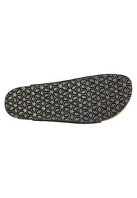 Shoe sole featuring a black rubber material with a hexagonal pattern for grip, rounded toe, and a brown leather edge.
