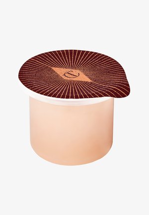 Container with a beige body and a round lid featuring a dark red sunburst pattern and a central diamond shape with a symbol.